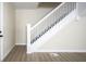 Bright staircase features white banisters and neutral walls that lead to upper level at 2216 Bethel Ave, Indianapolis, IN 46203