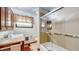 Clean bathroom with glass shower, marble vanity, and window at 2455 Lenvoil Rd, Martinsville, IN 46151