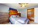 Spacious bedroom with wood furnishings, ceiling fan, and neutral decor at 2455 Lenvoil Rd, Martinsville, IN 46151