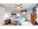 Cozy bedroom featuring a ceiling fan, carpet, and natural light from the window at 2455 Lenvoil Rd, Martinsville, IN 46151