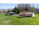 Charming home with a green metal roof, matching outbuilding, and a spacious lawn at 2455 Lenvoil Rd, Martinsville, IN 46151