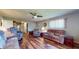Inviting living room with hardwood floors, a ceiling fan, and comfortable furniture at 2455 Lenvoil Rd, Martinsville, IN 46151