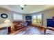 Cozy living room featuring hardwood floors, neutral walls, and comfortable seating at 2455 Lenvoil Rd, Martinsville, IN 46151