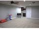 Finished basement with a kitchenette and ample space for entertainment or recreation at 2599 Liatris Dr, Plainfield, IN 46168