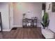 Inviting entryway featuring hardwood floors, a decorative console table, and a welcoming Gathering sign at 2599 Liatris Dr, Plainfield, IN 46168