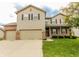 Charming two-story home featuring brick and siding exterior, three-car garage and a well-maintained front lawn at 2599 Liatris Dr, Plainfield, IN 46168