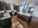 Beautiful kitchen featuring granite countertops, stainless steel appliances, a large island and hardwood floors at 2599 Liatris Dr, Plainfield, IN 46168