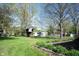 Lush backyard featuring a treehouse, outbuildings, and mature trees at 30 Sleepy Hollow Ct, Westfield, IN 46074