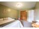 Bedroom featuring one bed, closet, and green walls at 30 Sleepy Hollow Ct, Westfield, IN 46074