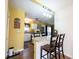 Well-lit kitchen and eat in area with stainless appliances and bar stool seating at 30 Sleepy Hollow Ct, Westfield, IN 46074
