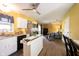 Bright eat-in kitchen features stainless steel appliances, white cabinets, and tile island at 30 Sleepy Hollow Ct, Westfield, IN 46074