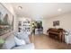 Bright and airy living room offering a view of the kitchen and white built in shelving at 30 Sleepy Hollow Ct, Westfield, IN 46074