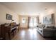 Inviting living room with hardwood floors, a large window, piano, and comfortable seating at 30 Sleepy Hollow Ct, Westfield, IN 46074
