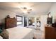 Bright bedroom features a ceiling fan, mirrored closet, and neutral decor at 30 Sleepy Hollow Ct, Westfield, IN 46074
