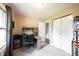 Well-lit office area with a desk, chair, and storage, plus closet and doorway to other rooms at 30 Sleepy Hollow Ct, Westfield, IN 46074