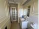 Bathroom features a single sink vanity, mirror, and a tiled backsplash at 3010 Lake Shore Dr # D, Indianapolis, IN 46205
