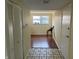 Bright entryway with tile floors leading into a room with wood floors and a window at 3010 Lake Shore Dr # D, Indianapolis, IN 46205