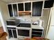 Cozy kitchen with black and white cabinets, sleek appliances, and efficient layout at 3010 Lake Shore Dr # D, Indianapolis, IN 46205