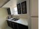 Functional kitchen showcasing a double sink and tiled backsplash at 3010 Lake Shore Dr # D, Indianapolis, IN 46205