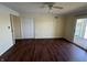 The living room has hardwood floors, a ceiling fan, and sliding glass doors to the outside at 3010 Lake Shore Dr # D, Indianapolis, IN 46205