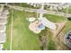 Aerial view of the neighborhood playground and green space with trees in a quiet community at 3038 Arrowroot Ln, Indianapolis, IN 46239