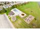 Aerial view of community pool and playground area, displaying shared amenities and recreational spaces within the neighborhood at 3038 Arrowroot Ln, Indianapolis, IN 46239