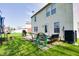 A spacious backyard with a patio, grill, and play area, perfect for outdoor entertaining and relaxation at 3038 Arrowroot Ln, Indianapolis, IN 46239