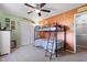 A cozy bedroom featuring a bunk bed, closet, ceiling fan, and colorful decorations, perfect for or guests at 3038 Arrowroot Ln, Indianapolis, IN 46239
