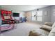 Large bonus room with a basketball game and an electric fireplace at 3038 Arrowroot Ln, Indianapolis, IN 46239