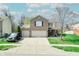 Charming two-story home with a brick facade, two-car garage, and well-maintained front yard at 3038 Arrowroot Ln, Indianapolis, IN 46239