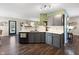 Updated kitchen with gray cabinets, white countertops, and modern appliances at 3038 Arrowroot Ln, Indianapolis, IN 46239