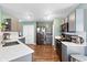 Modern kitchen featuring stainless steel appliances, gray cabinets, and white countertops at 3038 Arrowroot Ln, Indianapolis, IN 46239