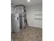 Basement equipment room with water heater, furnace, and shelving at 3097 Limber Pine Dr, Whiteland, IN 46184
