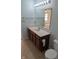 Bathroom featuring a vanity and a large mirror at 3097 Limber Pine Dr, Whiteland, IN 46184