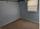 Bedroom with carpet flooring, window and light blue walls at 3097 Limber Pine Dr, Whiteland, IN 46184