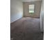 Bedroom with plush carpeting and natural light at 3097 Limber Pine Dr, Whiteland, IN 46184
