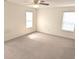 Spacious bedroom with neutral carpet, ceiling fan, and two bright windows at 3097 Limber Pine Dr, Whiteland, IN 46184