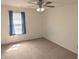 Carpeted bedroom with ceiling fan and natural light at 3097 Limber Pine Dr, Whiteland, IN 46184