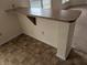 Kitchen counter with breakfast bar and tile flooring at 3097 Limber Pine Dr, Whiteland, IN 46184