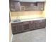 Bright kitchen featuring tile flooring and wood cabinetry with plenty of counter space at 3097 Limber Pine Dr, Whiteland, IN 46184