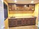 Well-lit kitchen featuring ample wood cabinetry, a sink, and plenty of countertop space at 3097 Limber Pine Dr, Whiteland, IN 46184