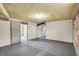 Spacious unfinished basement with painted brick, concrete floor, sliding door and utility access at 3140 N Washington Blvd, Indianapolis, IN 46205