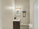 Compact bathroom featuring a vanity with storage, modern lighting, and functional fixtures, maximizing space and style at 3140 N Washington Blvd, Indianapolis, IN 46205