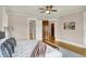 Bedroom boasts wood floors, ceiling fan and white trim at 3140 N Washington Blvd, Indianapolis, IN 46205