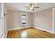 A serene room with hardwood floors, a ceiling fan, and natural light at 3140 N Washington Blvd, Indianapolis, IN 46205