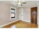 Bedroom with hardwood floors, single window, and closet with classic trim at 3140 N Washington Blvd, Indianapolis, IN 46205