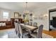 Charming dining room with a rustic table, elegant chandelier, and a built-in cabinet, creating a cozy atmosphere at 3140 N Washington Blvd, Indianapolis, IN 46205