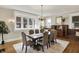 Bright dining room featuring a rustic table, chandelier, and ample natural light at 3140 N Washington Blvd, Indianapolis, IN 46205