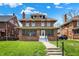 Charming two-story brick home with a covered front porch and well-maintained lawn at 3140 N Washington Blvd, Indianapolis, IN 46205
