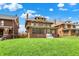 Beautiful brick home featuring a covered porch, well-manicured lawn, and mature trees at 3140 N Washington Blvd, Indianapolis, IN 46205
